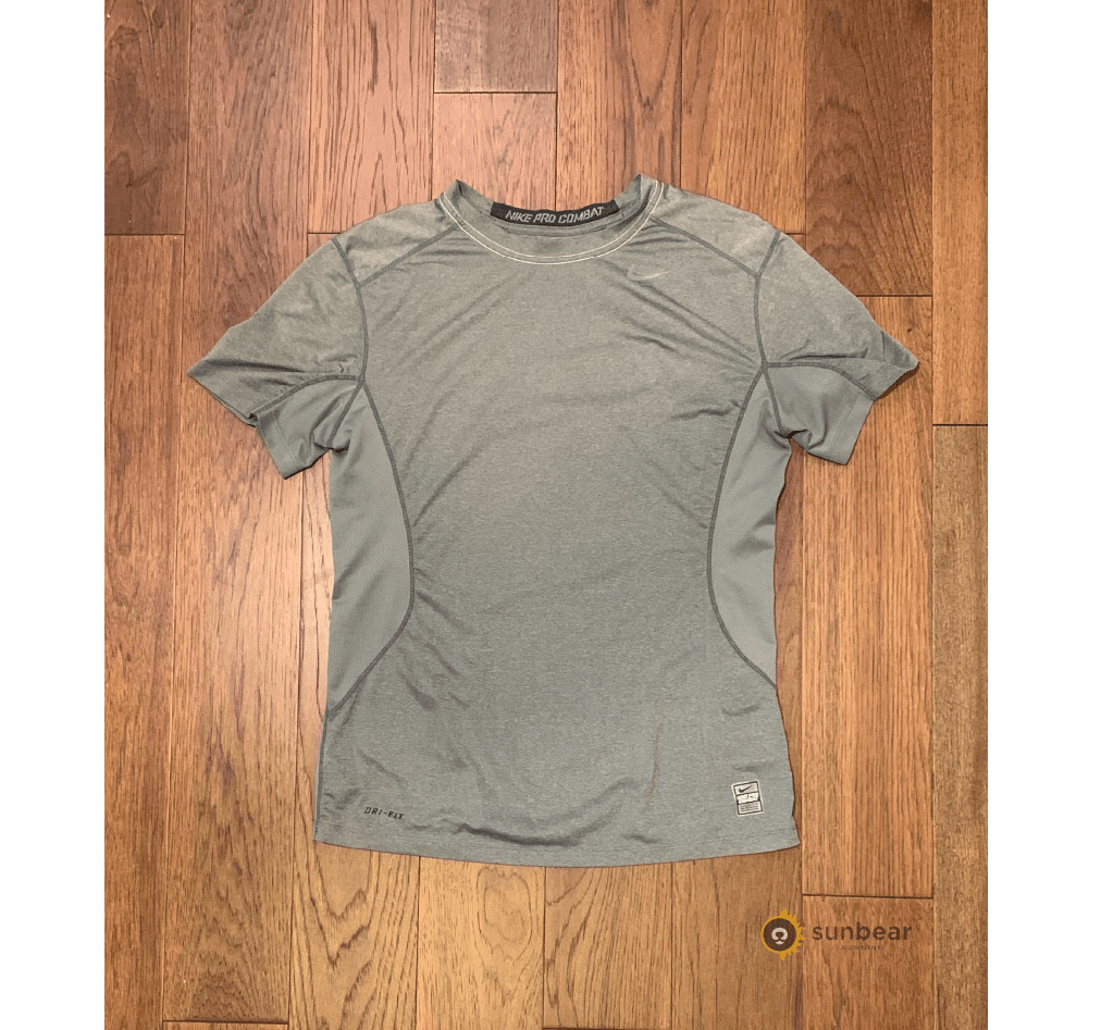 Short-sleeve running shirt illustrating the quick-drying top recommended for warmer rainy runs