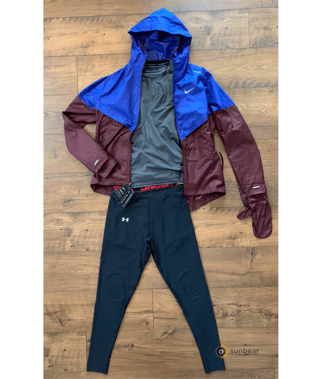 Layered running outfit with jacket and tights showing the recommended setup for colder rainy conditions