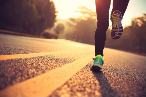 Runner on a neighborhood street illustrating the different types of weekly runs discussed here